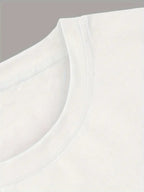 Close-up of a white shirt with a collar detail on a light gray background
