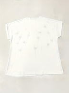 White t-shirt on a light beige background