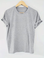 Gray t-shirt on a wooden hanger against a white background