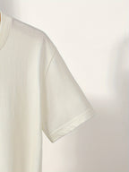 White t-shirt on a light gray background