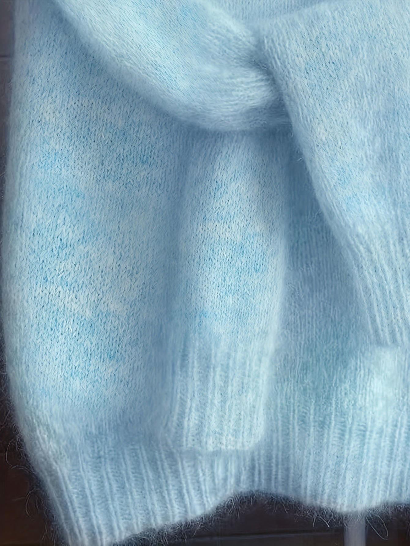 Close-up of a light blue knitted fabric texture