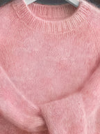 Close-up of a pink knitted sweater
