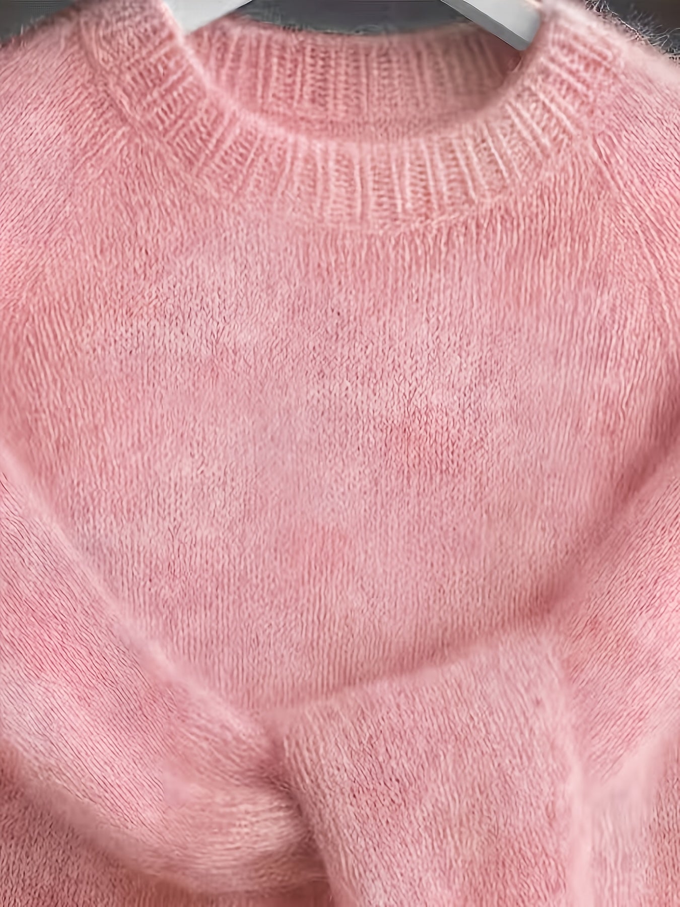 Close-up of a pink knitted sweater