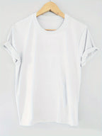 White blouse on a wooden hanger against a white background