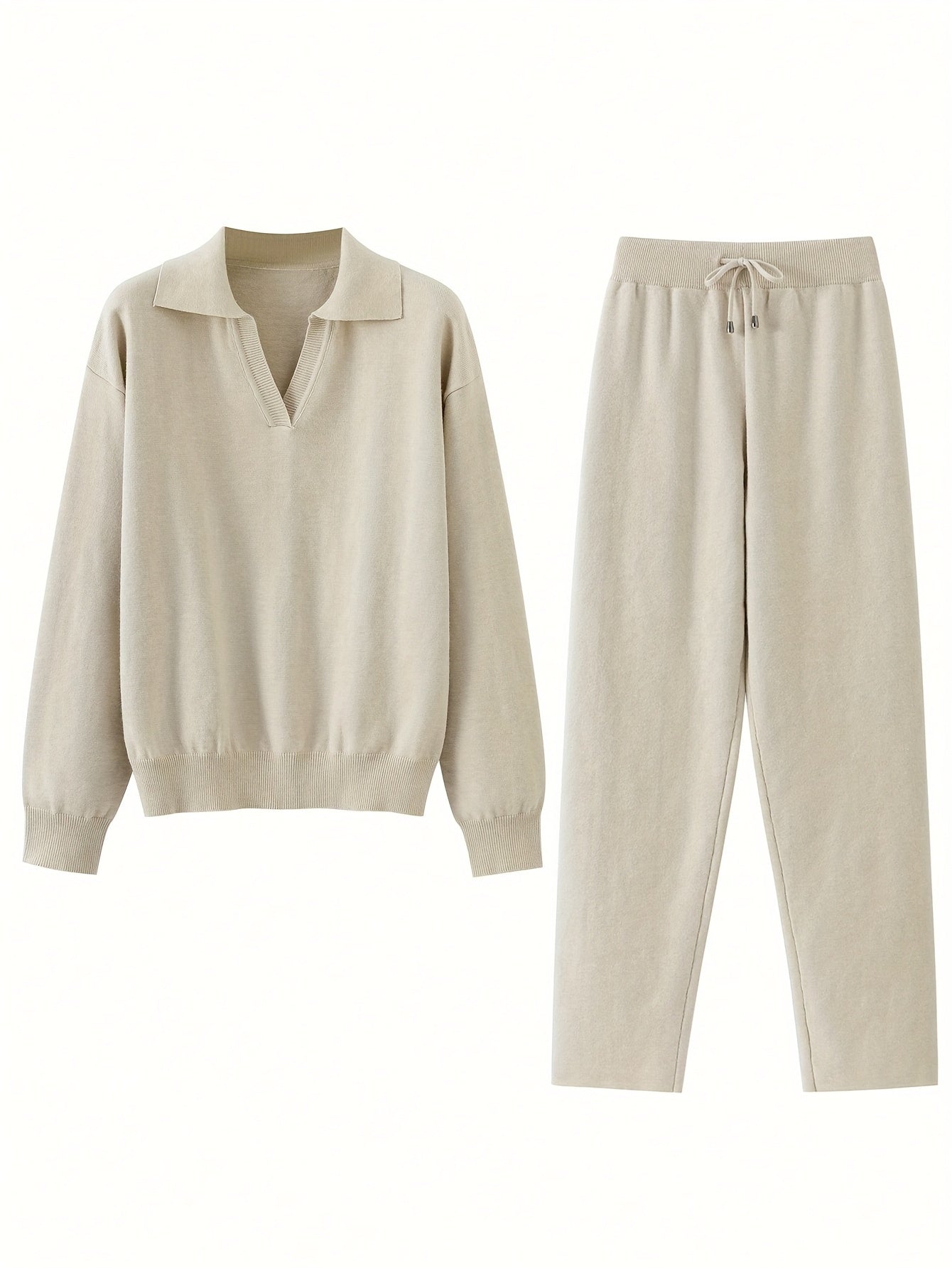 Beige sweatshirt and pants set on a white background