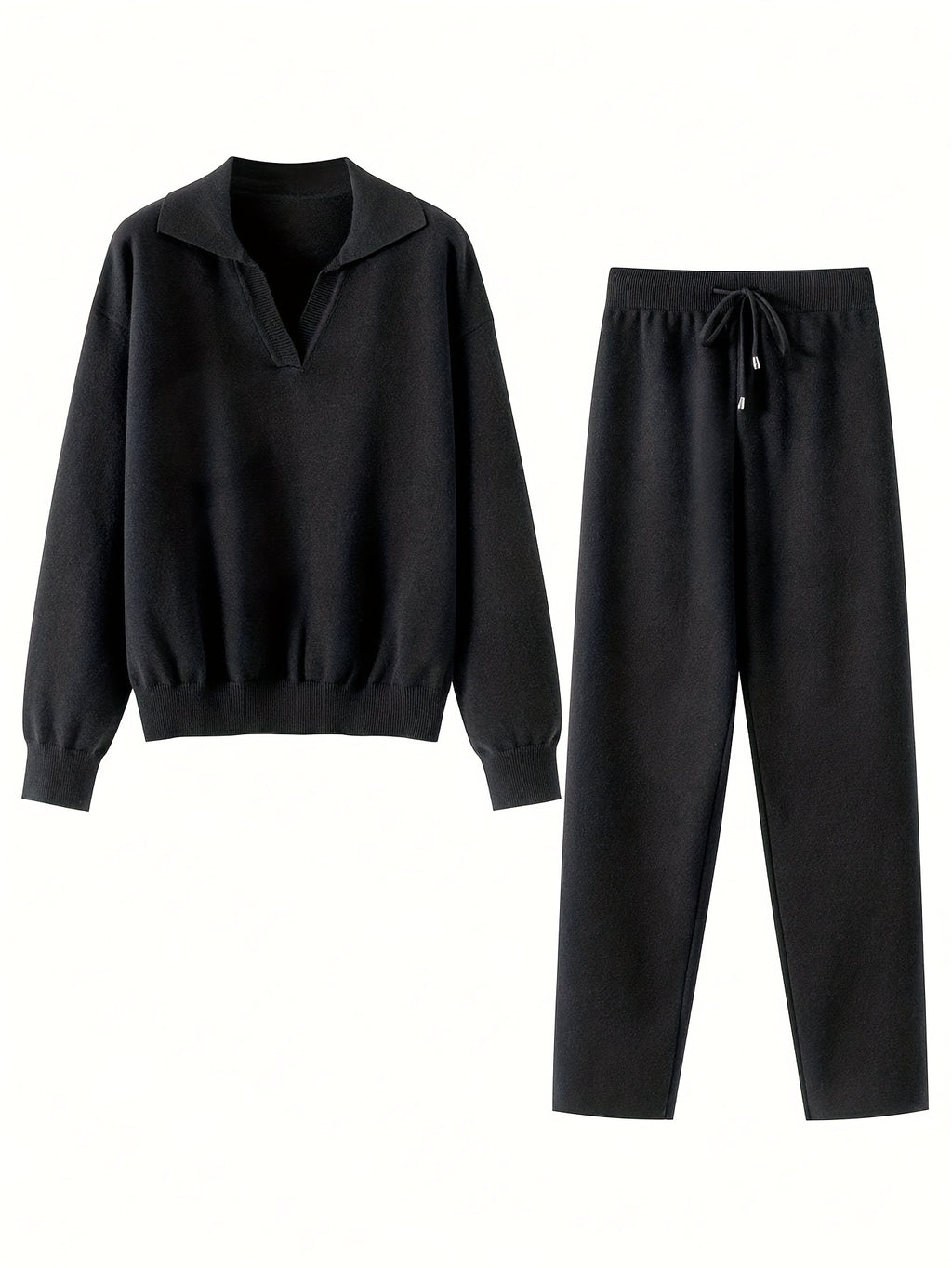 Black sweater and pants set on a white background