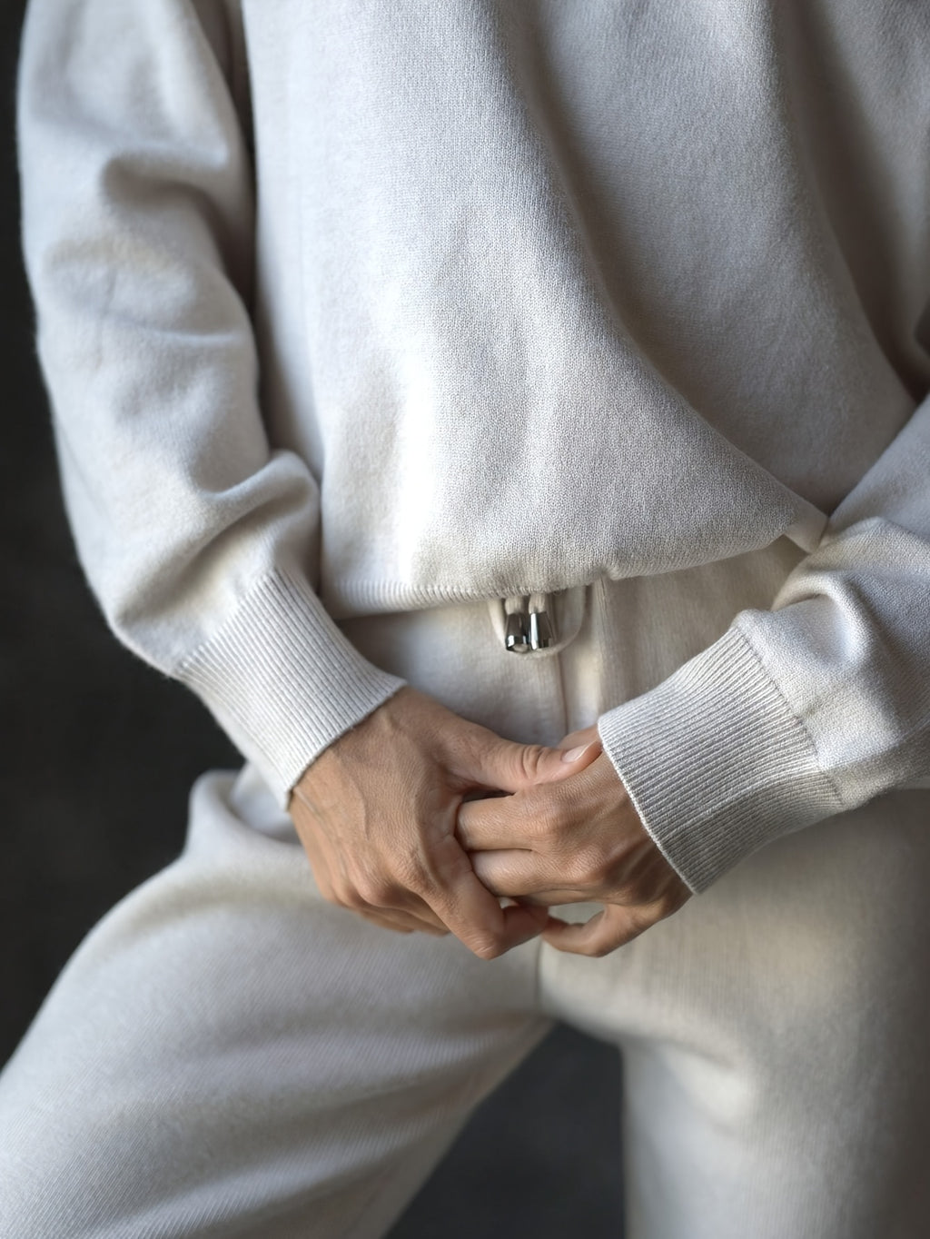 Person wearing a white outfit with a blurred background
