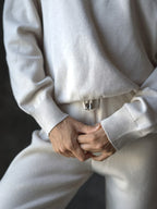 Person wearing a white outfit with a blurred background