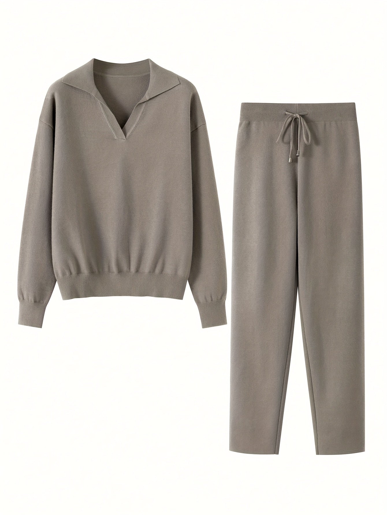 Beige sweater and pants set on a white background