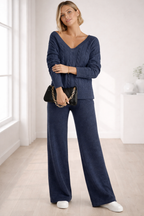 Woman wearing a blue outfit in a bright room