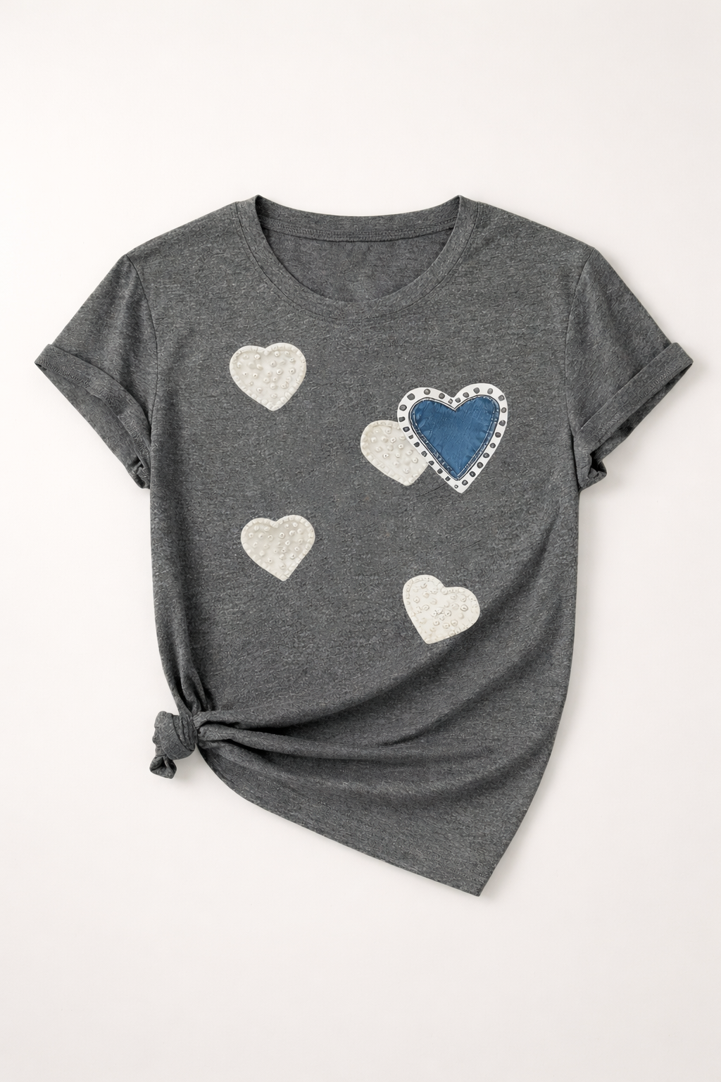 Gray t-shirt with heart designs on a white background