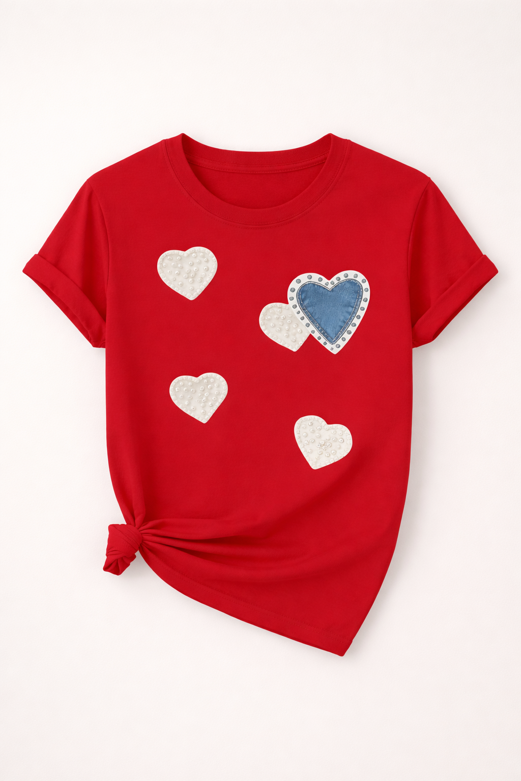 Red t-shirt with heart patterns on a white background