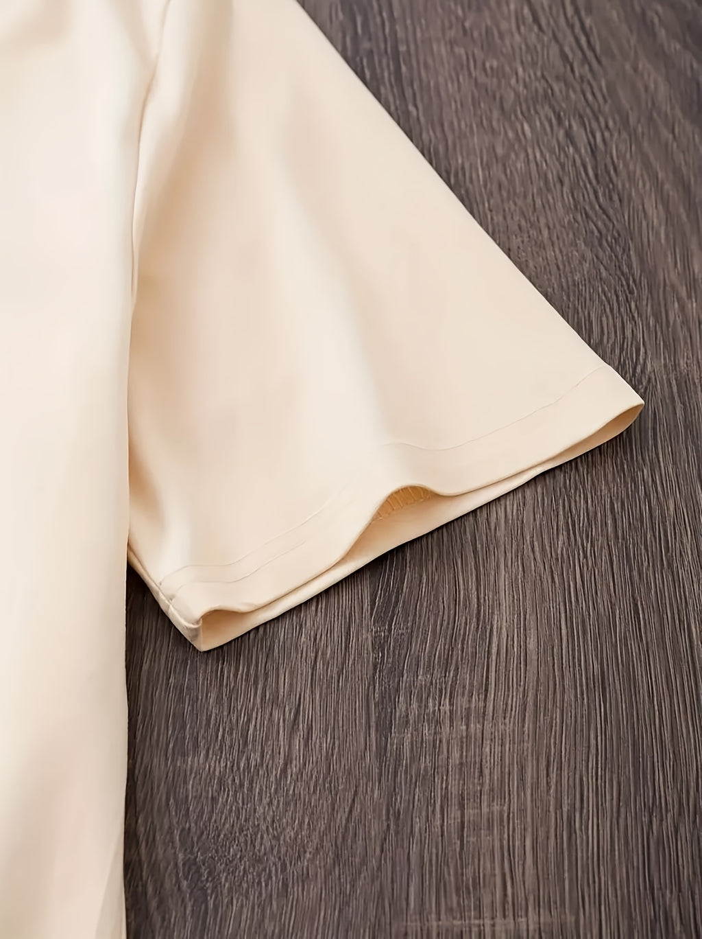 Beige fabric on a wooden surface