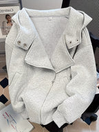 Gray jacket on a mannequin with a blurred background