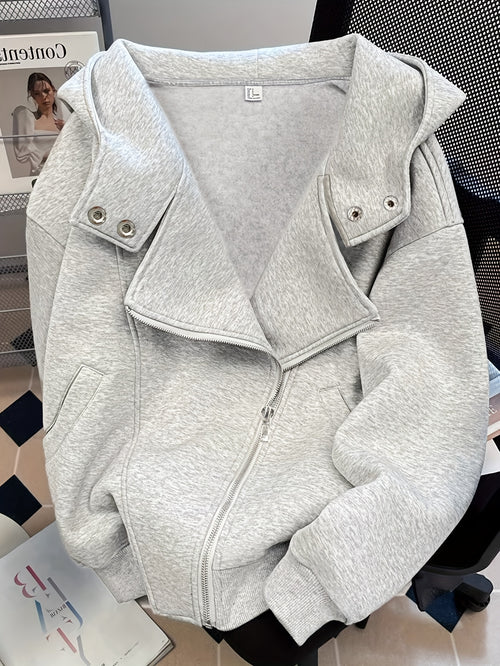 Gray jacket on a mannequin with a blurred background