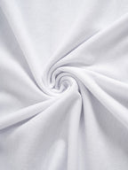 Close-up of white fabric with a swirl pattern
