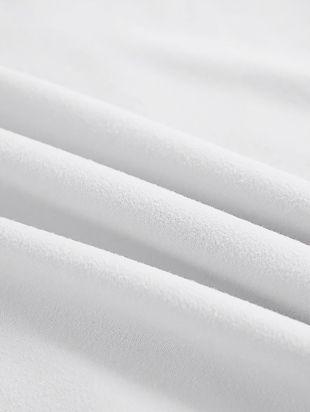 Close-up of white fabric with folds